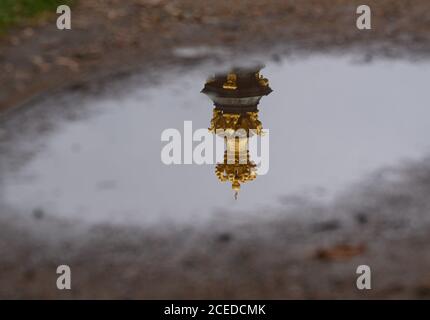 01 September 2020, Saxony, Dresden: The crown gate on the Dresden Zwinger is reflected in a puddle. Photo: Robert Michael/dpa-Zentralbild/ZB Stock Photo