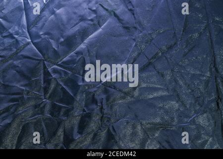 Closeup shot of a dark-colored crumpled paper texture Stock Photo