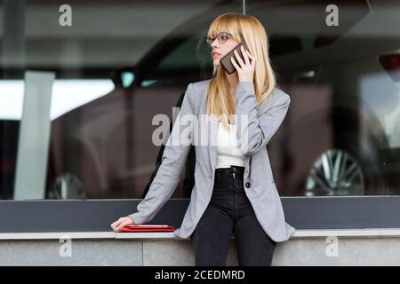 Young beautiful Woman talking on phone Stock Photo