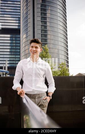 Cheerful man near railing Stock Photo