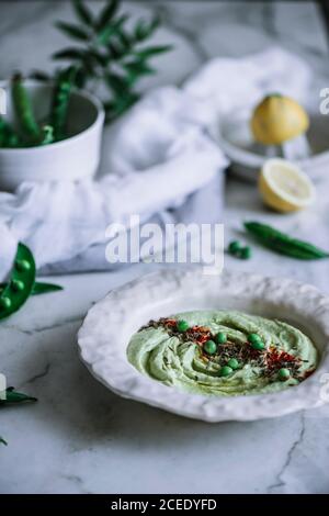 Bowl with tasty mashed peas Stock Photo