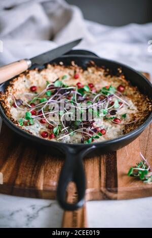 Omelette with herbs on cutting board Stock Photo