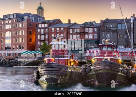 Portsmouth, New Hampshire, USA town cityscape with tugboats in the morning. Stock Photo