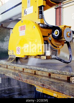 Marble Cutting Machine. Industrial marble cutting factory. Powerful and modern marble processing machine. Stock Photo