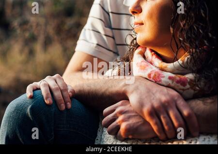 crop couple walking at sunset in old road Stock Photo