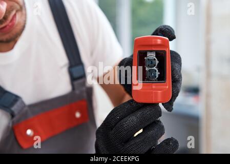 Male worker using laser level. Renovation concept Stock Photo
