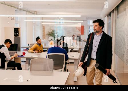 Handsome adult man standing in office Stock Photo