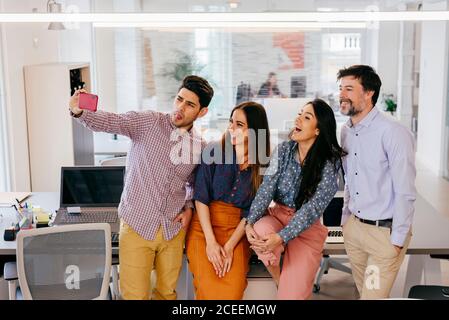 Office employees taking selfie Stock Photo