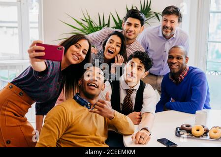 Office employees taking selfie Stock Photo