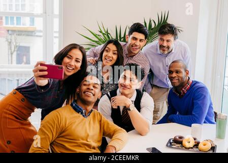 Office employees taking selfie Stock Photo