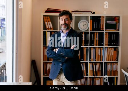 Adult man posing in office Stock Photo