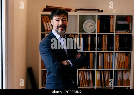 Adult man posing in office Stock Photo