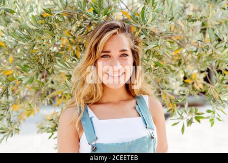 Smiling Woman at tree Stock Photo