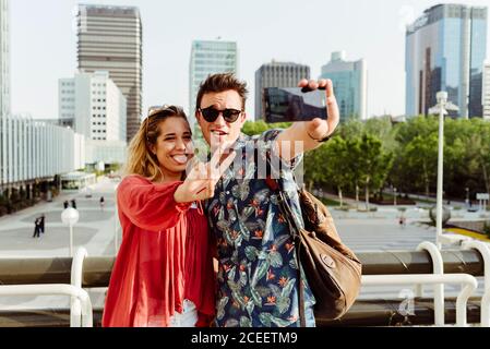 Couple taking selfie at handrail Stock Photo