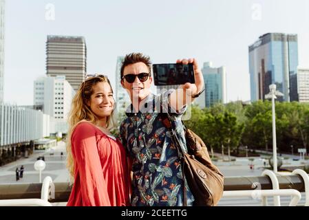 Couple taking selfie at handrail Stock Photo