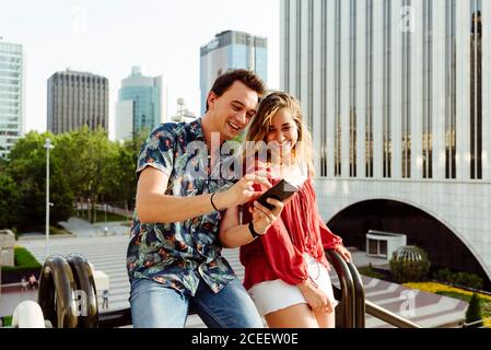 Couple taking selfie at handrail Stock Photo