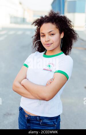 Confident smiling young ethnic Woman looking at camera Stock Photo