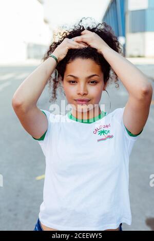 Confident smiling young ethnic Woman looking at camera Stock Photo