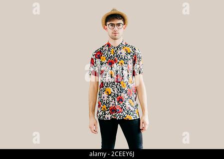 Young stylish man posing at white wall Stock Photo