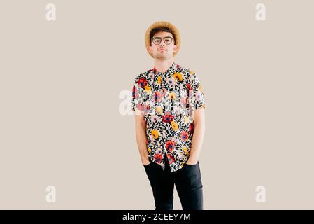 Young stylish man posing at white wall Stock Photo