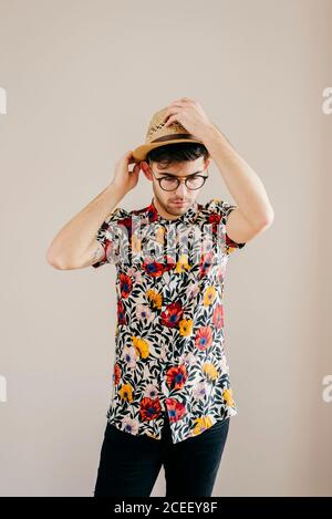 Young stylish man posing at white wall Stock Photo