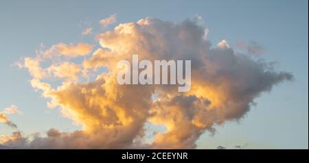 dramatic clouds on sunset sky Stock Photo
