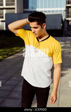 Handsome young man standing in city Stock Photo