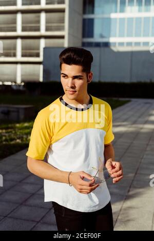 Handsome young man standing in city Stock Photo