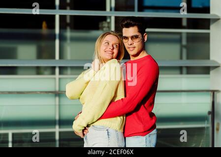 Young couple hugging in city Stock Photo