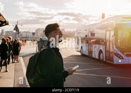 Stylish dreaming man with smartphone Stock Photo