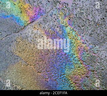 Gasoline flows on the pavement. Stock Photo