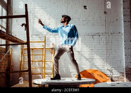 Black man dancing on table Stock Photo