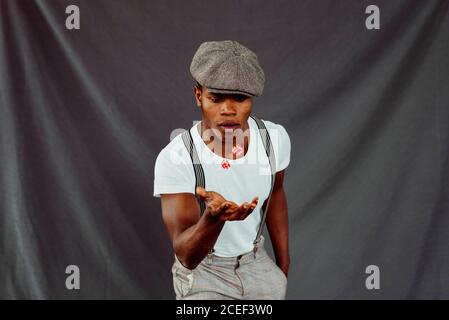 African-American man throwing up dices Stock Photo