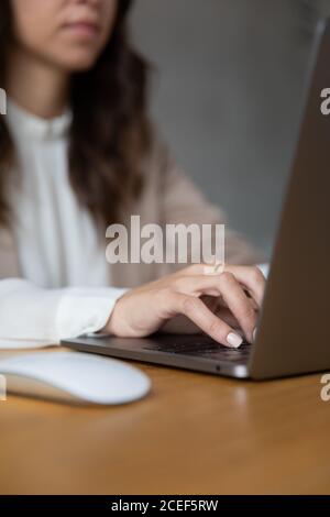 Young girl working with her laptop at home