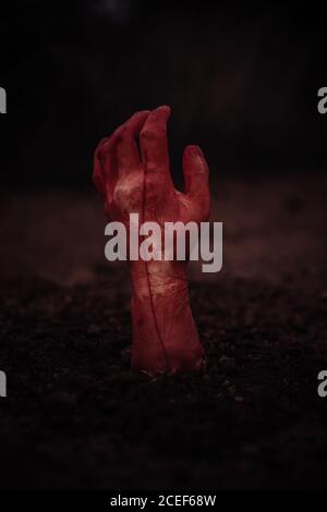 Zombie coming out of the ground. Halloween background Stock Photo