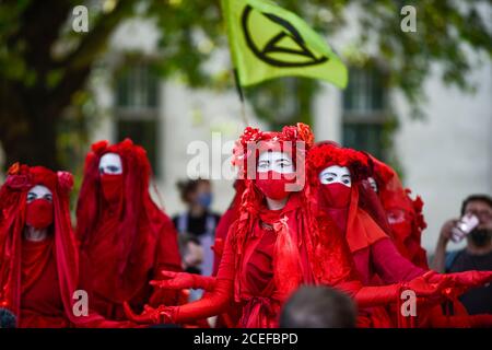 London, UK.  1 September 2020.  Red brigade activists from Extinction Rebellion take part in a climate change protest in Parliament Square on the day that Members of Parliament return to Westminster after the summer recess. Credit: Stephen Chung / Alamy Live News Stock Photo