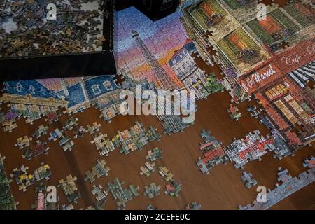 a jigsaw puzzle being assembled Stock Photo