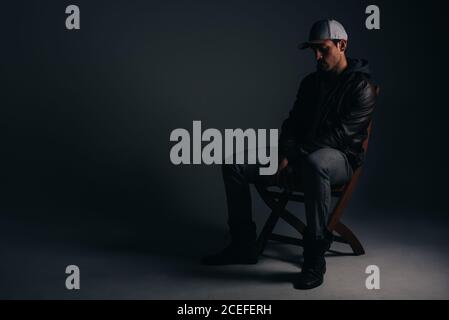 Young attractive man sitting in a studio Stock Photo