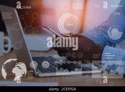 Modern Technologies. Analytic information diagram layered over black businessman working in office Stock Photo