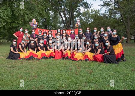 Posed group portrait of Chinese American dancers from the Wenzhou America New York troupe at their 5th anniversary performance in a park in New York. Stock Photo