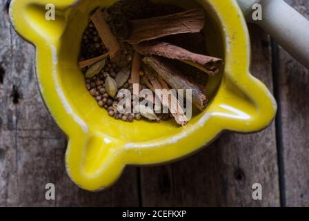 Mortal and pestle with spices Stock Photo