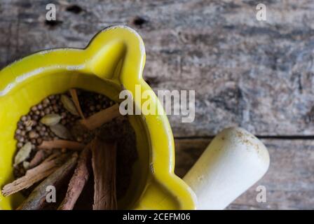 Mortal and pestle with spices Stock Photo