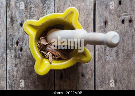 Mortal and pestle with spices Stock Photo