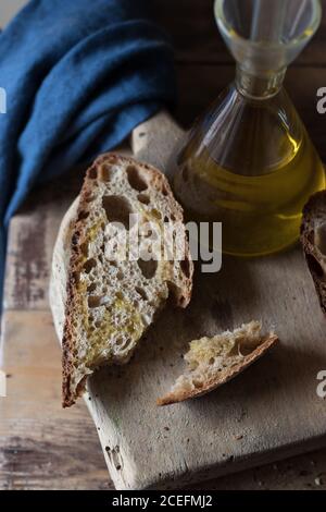 Pieces of wholegrain bread with oil Stock Photo