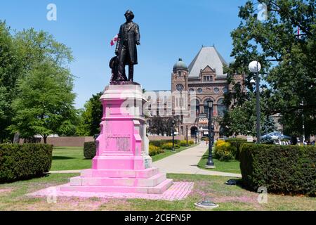 A statue of Sir John A MacDonald in Queen's Park, Toronto, after it was vandalized by Black Lives Matter and indigenous protesters. Stock Photo