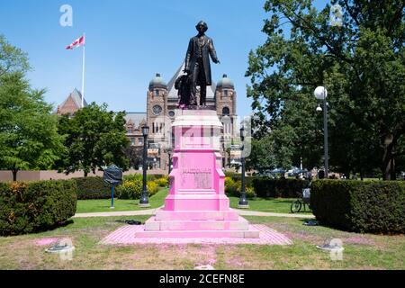 A statue of Sir John A MacDonald in Queen's Park, Toronto, after it was vandalized by Black Lives Matter and indigenous protesters. Stock Photo