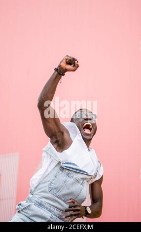 African man shouting victory clenched fist. Stock Photo