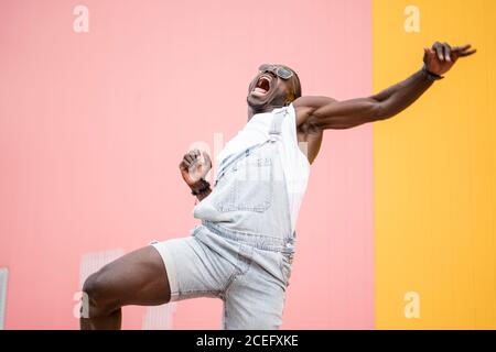 African man shouting victory clenched fist. Stock Photo
