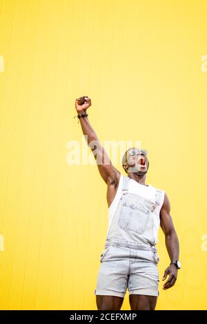 African man shouting victory clenched fist. Stock Photo