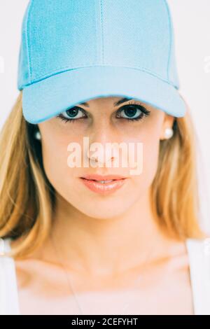 SportsWoman in blue cap standing in studio Stock Photo